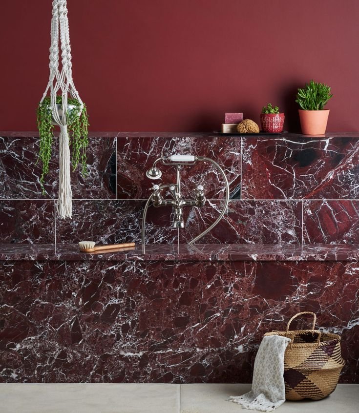 A striking, rich deep burgundy stone set through with a contrasting white vein creating the appearance of unmitigated luxury_